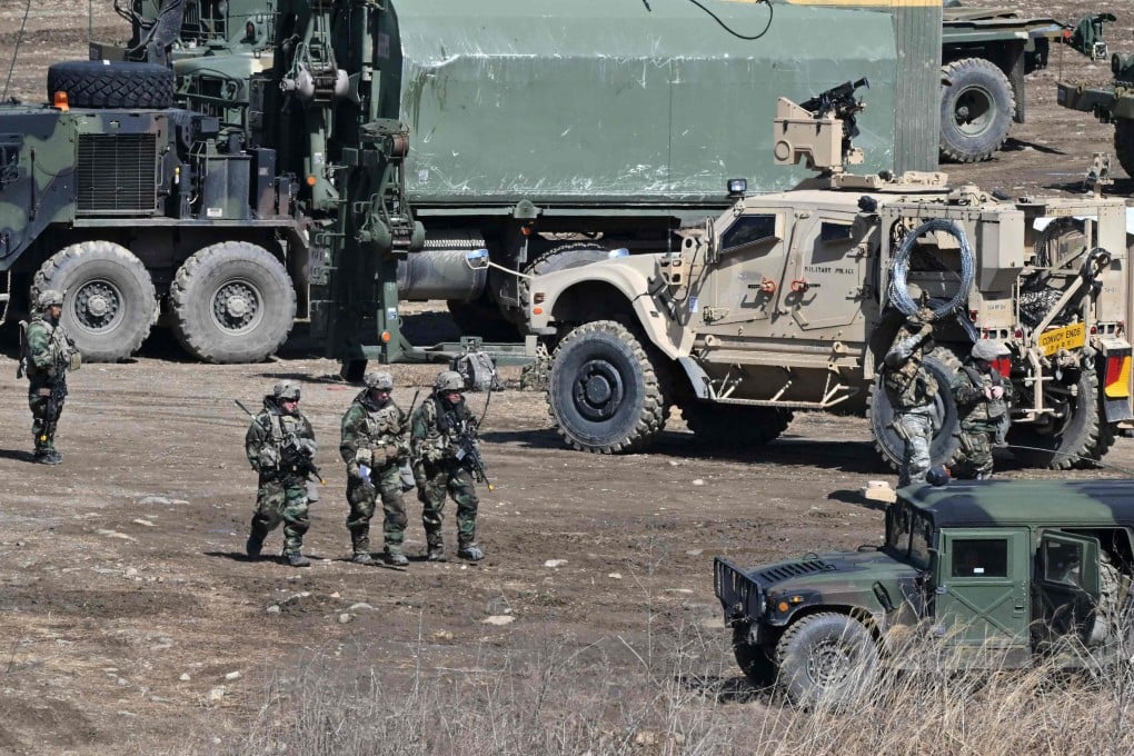 US soldiers walk past military vehicles at a military training field in the border city of Yeoncheon, South Korea, in 2023. Photo: AFP