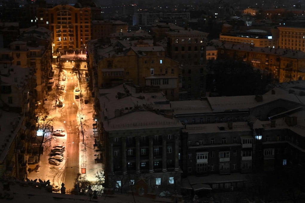An illuminated street is seen during an air attack in central Kyiv on Saturday. Photo: AFP