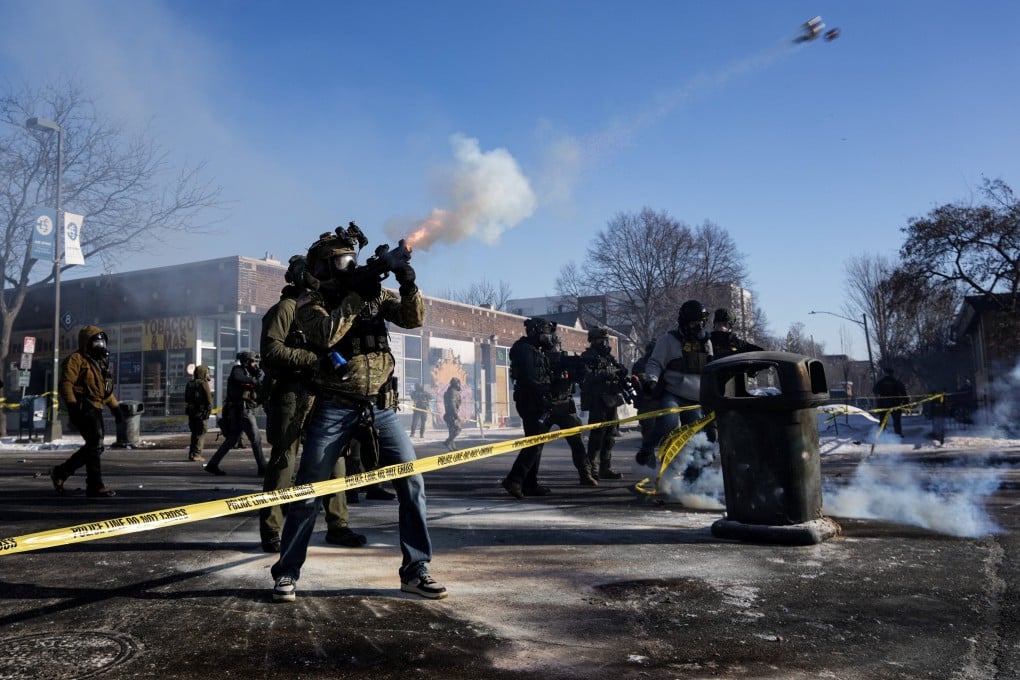 A federal agent shoots tear gas cannisters during scuffles at the scene of a shooting in Minneapolis, Minnesota, on Saturday. Photo: Reuters