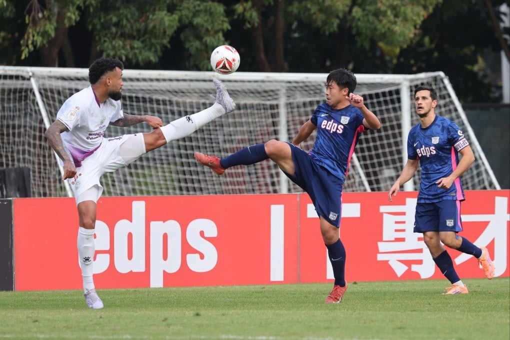 Kitchee’s Cheng Chin-lung (right) in a jostle for the ball with Tai Po’s Marcao at Tseung Kwan O Sports Ground on Sunday. Photo: Edmond So