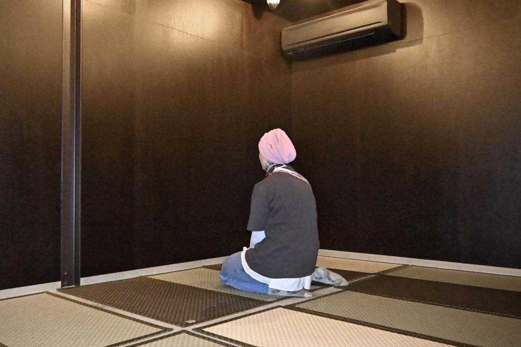 A Muslim woman prays in the prayer room at the World Exposition in Osaka, Japan, last year. Photo: Kyodo