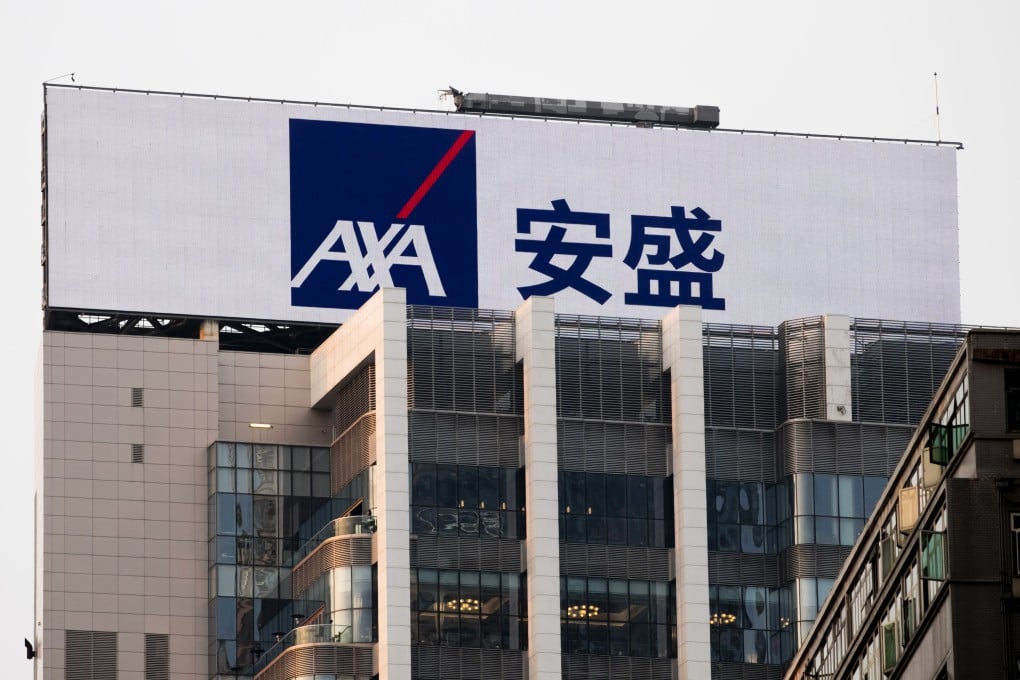 An advertisement for French insurer AXA is seen on a building in Hong Kong on February 27, 2018. Photo: Getty Images