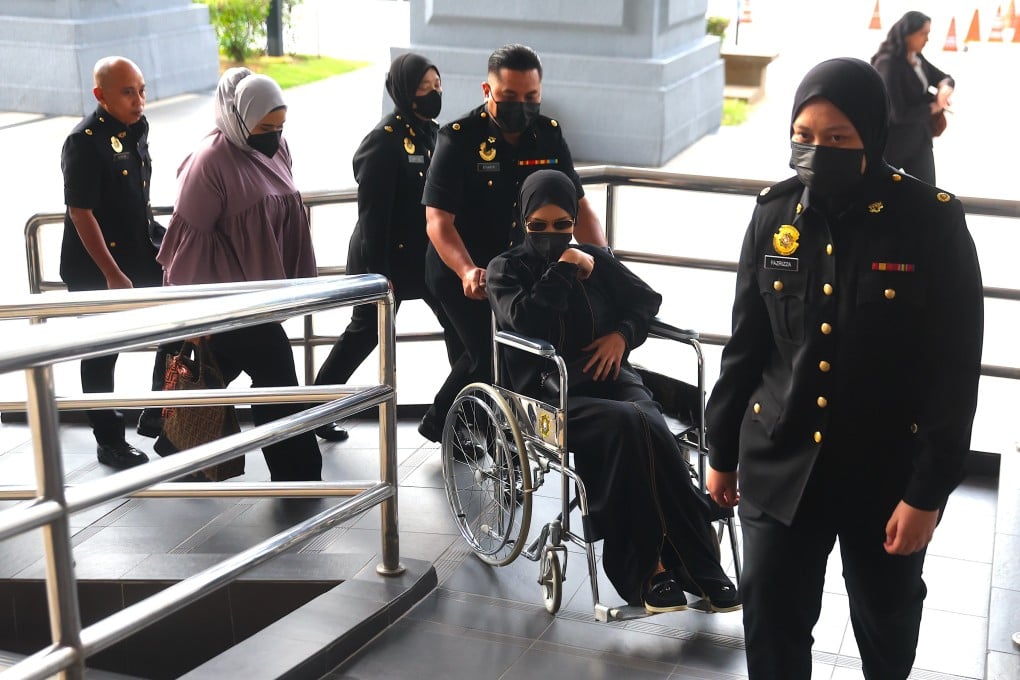 Former Malaysian army chief Muhammad Hafizuddeain Jantan’s wife, Salwani Anuar, is escorted in a wheelchair by Malaysian Anti-Corruption Commission officers at the Kuala Lumpur Court on January 22. She and her husband are facing multiple charges under Malaysia’s anti-money-laundering law.
Photo: EPA