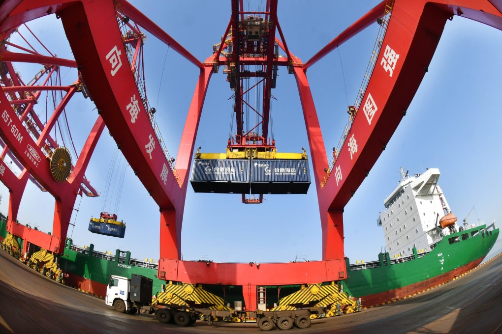 Cranes unload containers from a ship at Huanghua Port in China’s Hebei province on January 15. Photo: Xinhua