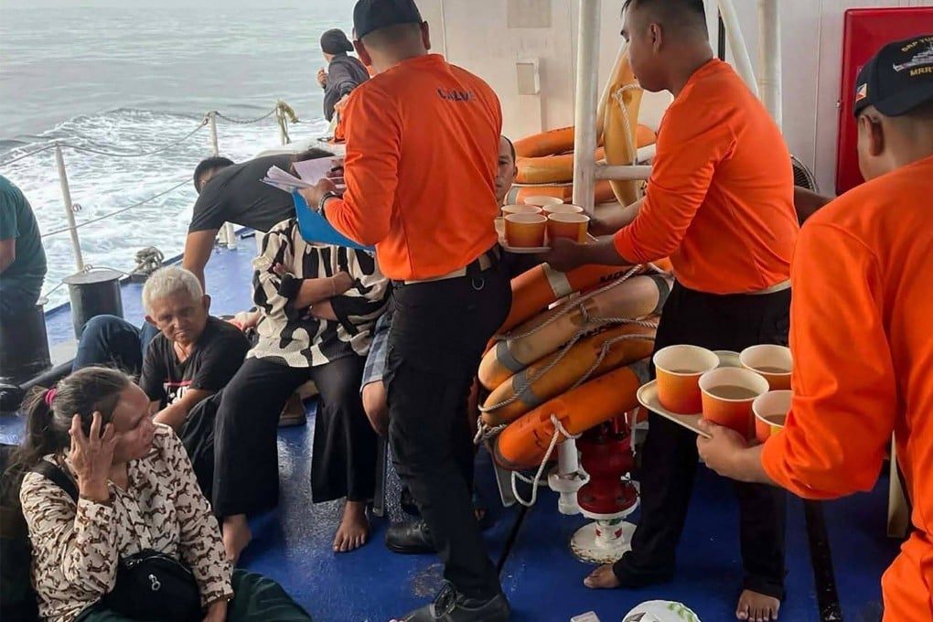 Coastguards attend to the survivors of the sunken MV Trisha Kerstin 3 in waters off Basilan province on Monday. Photo: Philippine Coast Guard/AFP