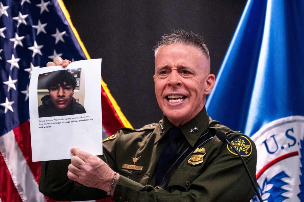 Border Patrol commander Gregory Bovino holds a sheet of paper showing alleged crimes by an undocumented immigrant. Photo: AFP