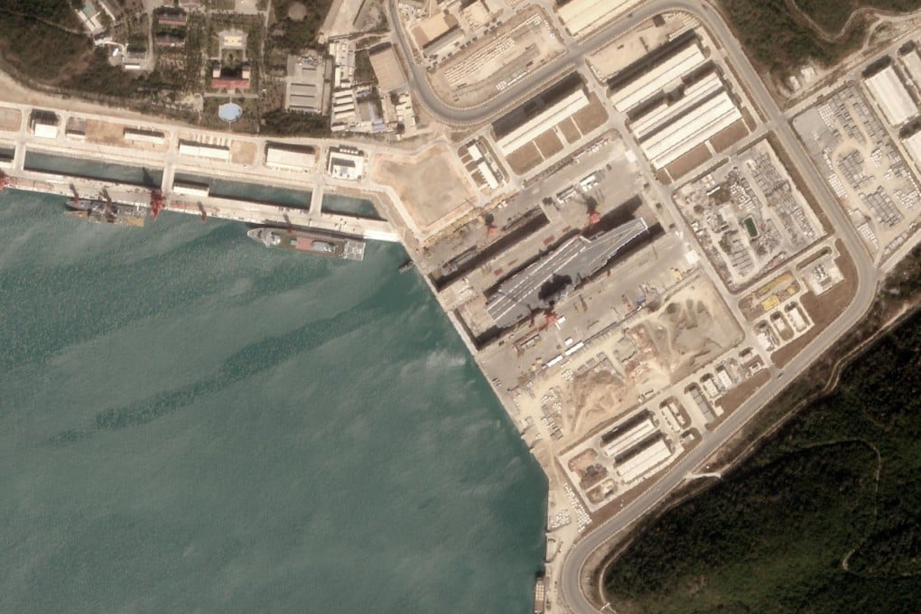 Analysis by a US geospatial intelligence company says satellite imagery shows the first use by a Chinese aircraft carrier of a new dry dock near the South China Sea. Photo: AllSource Analysis