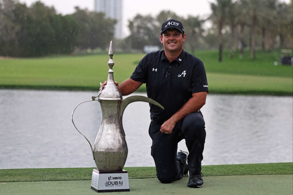 Patrick Reed poses with the trophy after winning the Dubai Desert Classic golf tournament. Photo: AFP