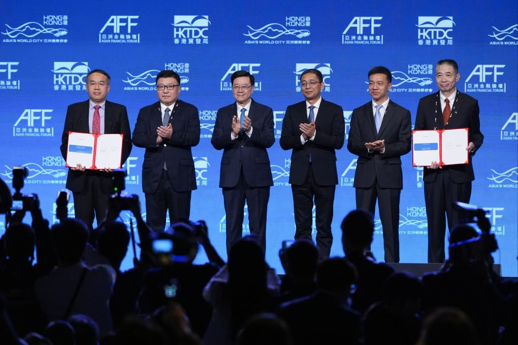 Chief Executive John Lee Ka-chiu (centre) and People’s Bank of China Deputy Governor Zhou Lan (second from left) witness the cooperation agreement between the Financial Services and the Treasury Bureau of Hong Kong and the Shanghai Gold Exchange at the 19th Asian Financial Forum at the Hong Kong Convention and Exhibition Centre in Wan Chai on January 26. Photo: Eugene Lee