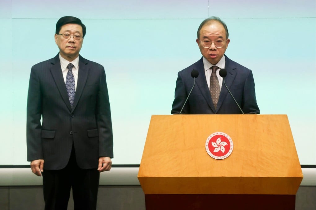 Chief Executive John Lee (left) and Erick Tsang. Photo: Jonathan Wong