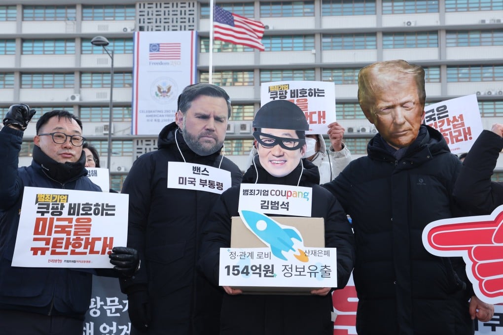 Protestors don masks of US President Donald Trump and Vice-President J.D. Vance at an anti-Trump rally outside the US Embassy in Seoul on Tuesday. Photo: Yonhap/EPA