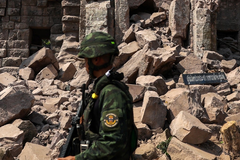 A soldier stands guard next to Prasat Ta Khwai on January 20. The temple was the site of clashes between Thailand and Cambodia in December last year. Photo: Reuters