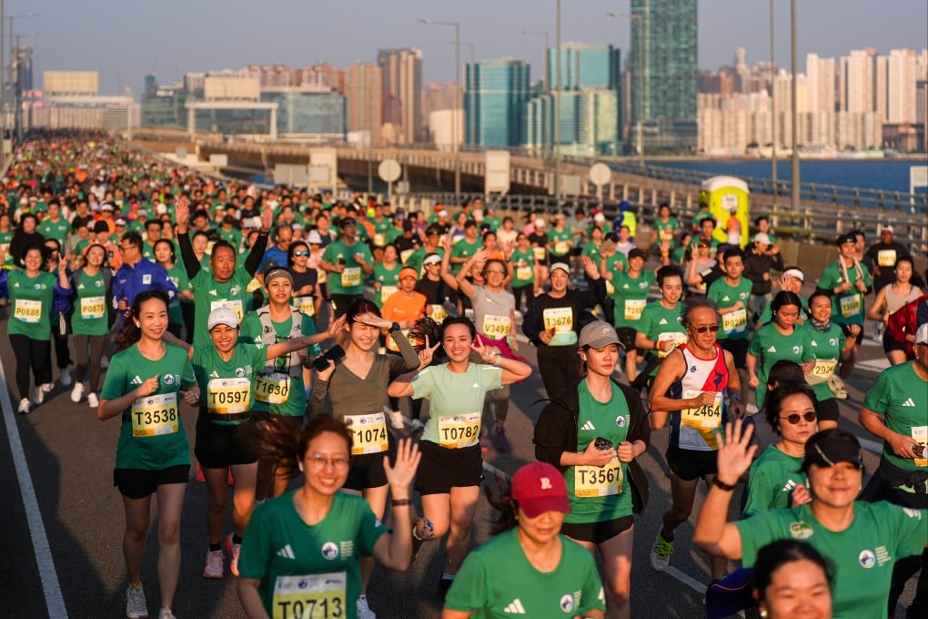 Athletes run along Island Eastern Corridor during the 10km race of the marathon. Photo: Eugene Lee