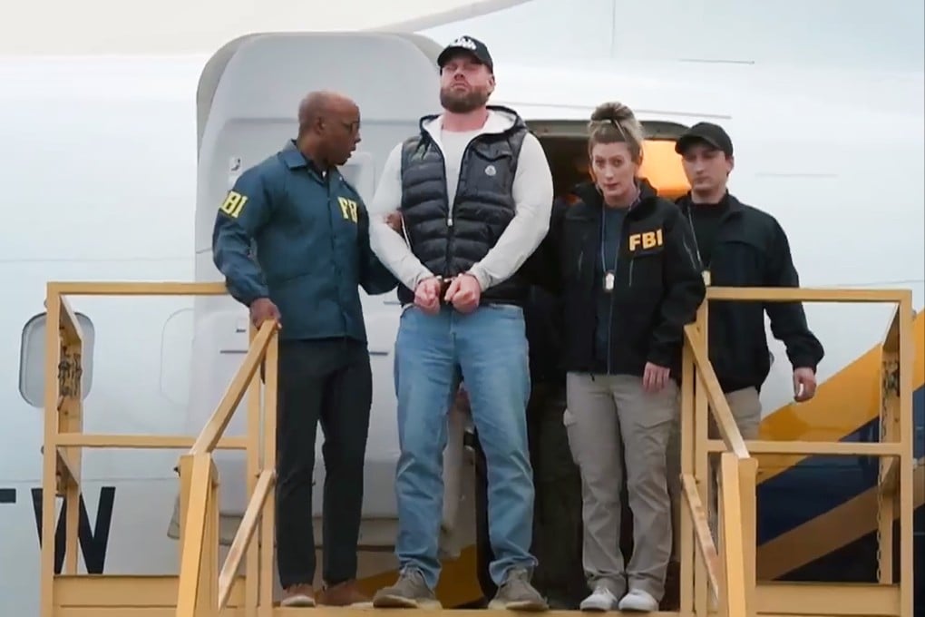 Ryan Wedding being is escorted off a plane by the FBI in Ontario, California on Friday. Photo: FBI via AP