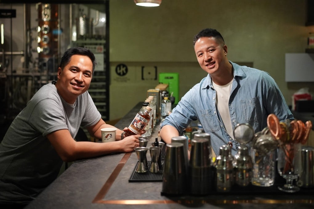 NIP Distilling founders Jeremy Li (left) and Nicholas Law are pictured at their gin distillery in Hong Kong’s Quarry Bay neighbourhood. The pair, who built the brand from the ground up, are seeing their tipple take off in Hong Kong and beyond. Photo: Elson Li