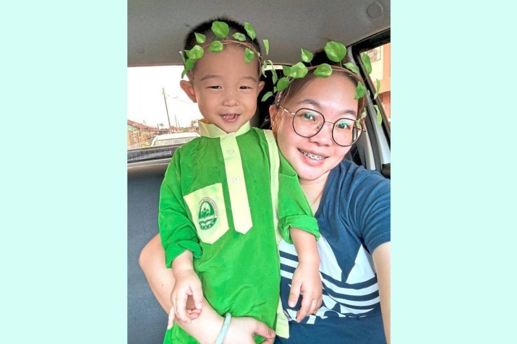 Chan Zhu Er takes a wefie with her son Low Zi Kang before dropping him off at his preschool in Chaah, Malaysia’s Johor. Photo: Chan/The Star