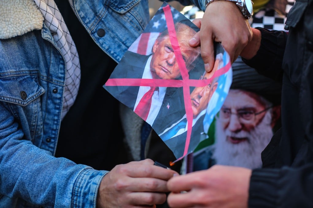 Iraqis burn a crossed-out picture of US President Trump and Israeli Prime Minister Netanyahu during a demonstration in front of the Iranian embassy in Baghdad, to show solidarity with Iran against US threats this month. Photo: dpa