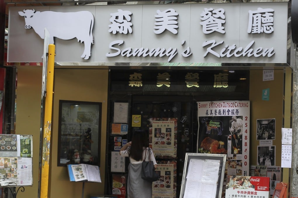 A customer stands outside Sammy’s Kitchen in Sai Ying Pun, Hong Kong, in June 2018. The restaurant has announced it will close - again - this time at the end of January 2026. Photo: Roy Issa