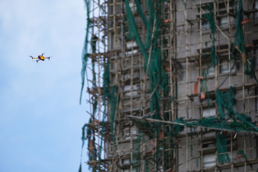 Drones being used to inspect the buildings at Wang Fuk Court in the aftermath of the deadly Tai Po blaze. Authorities will test how this technology can be used in a firefighting capacity. Photo: Eugene Lee