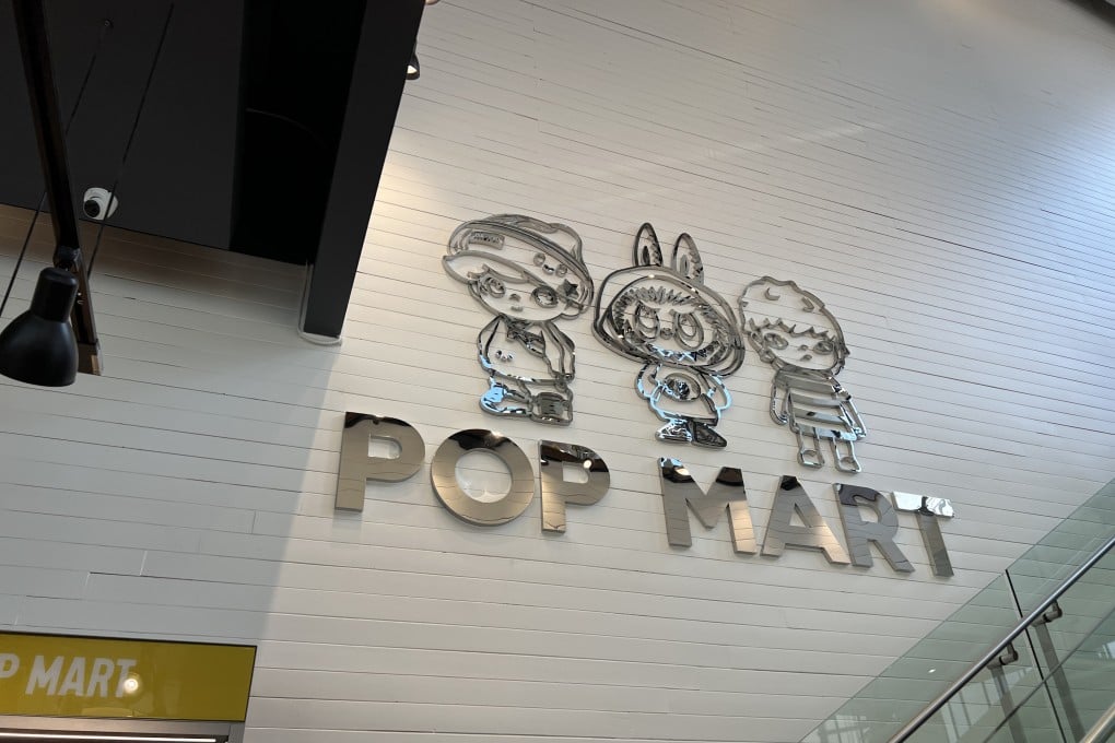 Interior signage featuring Pop Mart’s logo and collectible characters at a store in San Francisco. Photo: Getty Images