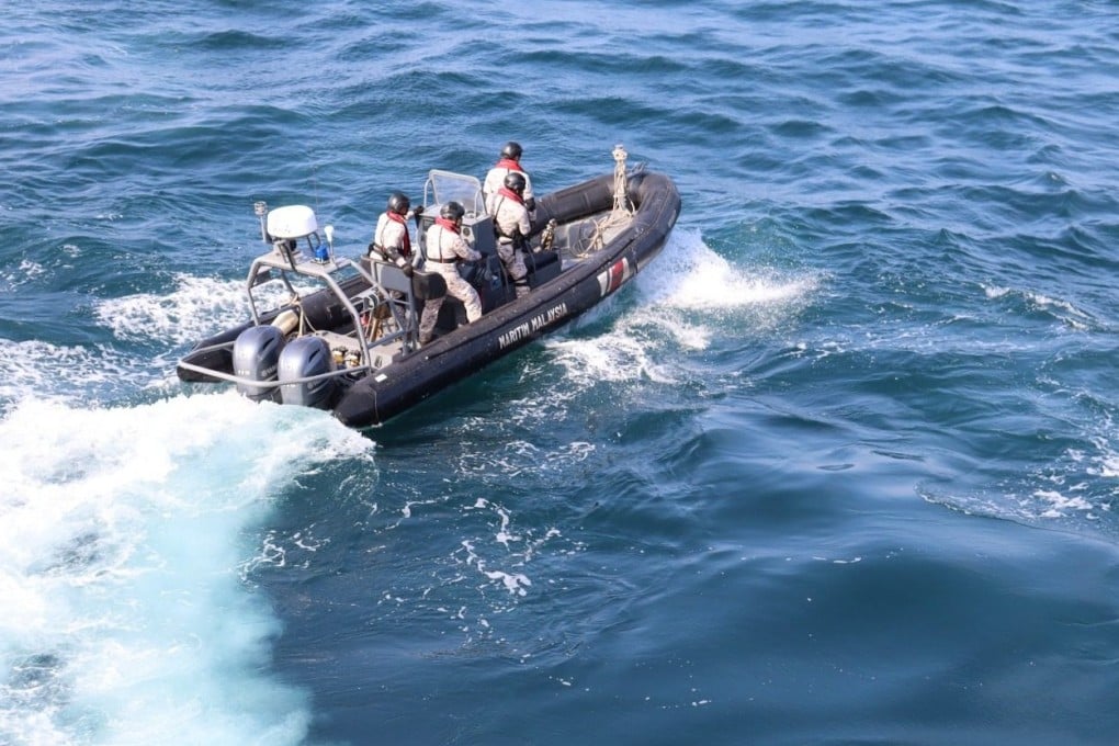 Several people were detained aboard an unregistered boat during an operation conducted by Malaysia’s Maritime Enforcement Agency on Monday. Photo: Facebook/maritimmalaysia