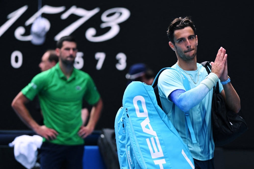 Italy’s Lorenzo Musetti applauds the fans as he walks off the court after retiring from his quarter-final match against Serbia’s Novak Djokovic on Wednesday. Photo: Reuters