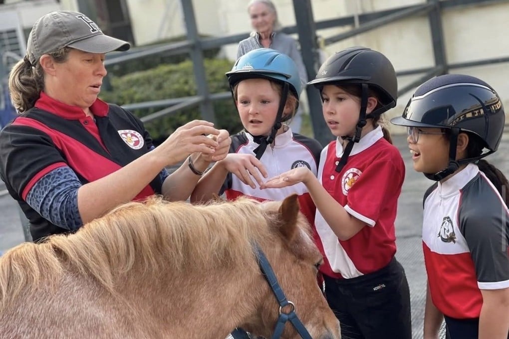 Children learn about how to care for horses as part of a Hong Kong Pony Club activity. The club helps nurture equine respect and skills, and fosters community through events and global connections. Photo: Instagram/HKPC