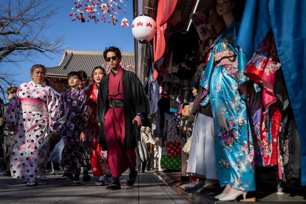 People walk through the Nakamise Shopping Street at the Asakusa district in Tokyo on January 8, 2026. Photo: AFP