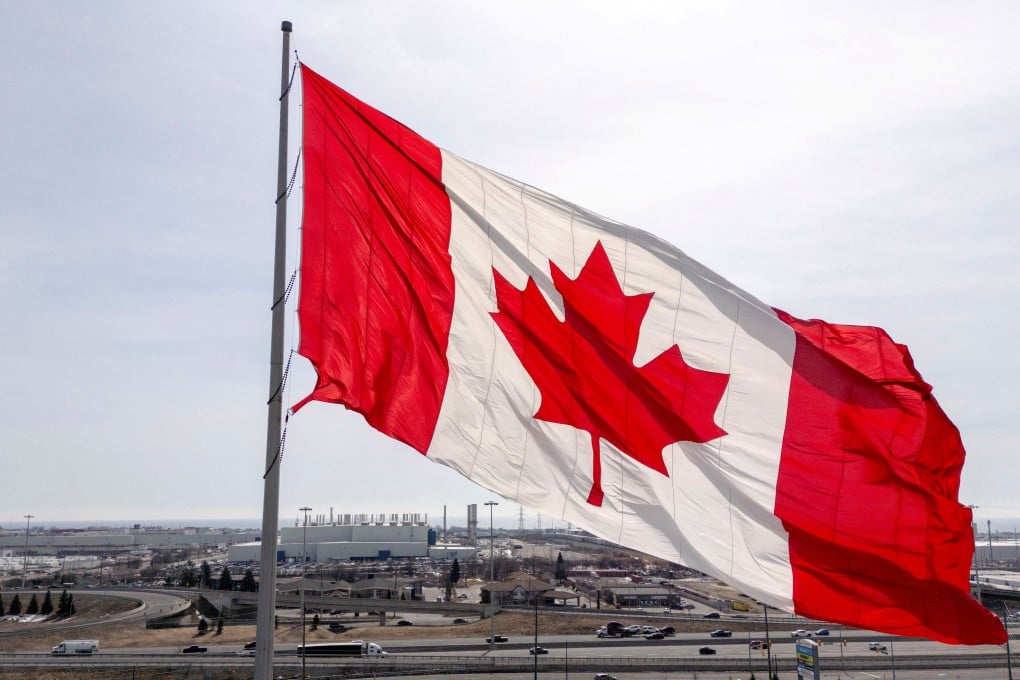 A Canadian flag waves in a plaza near the GM plant in Oshawa, Ontario, Canada, in March 2025. Photo: Reuters