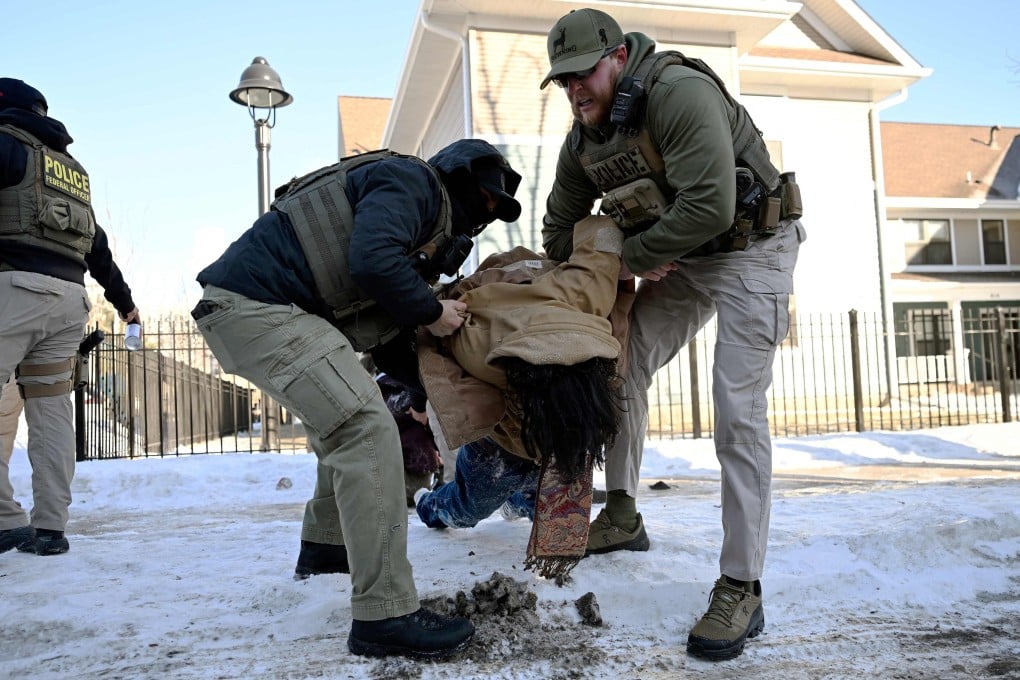 Federal agents detain a person in Minneapolis, Minnesota, on Thursday. Photo: AFP