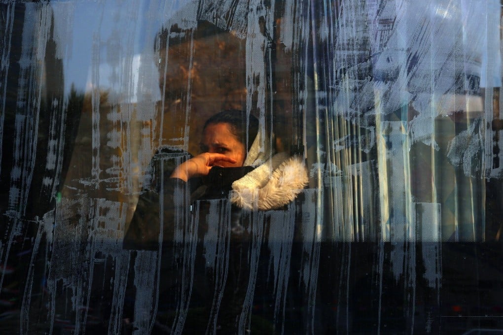 An woman sits on a bus in Tehran, Iran, on Thursday. Photo: EPA