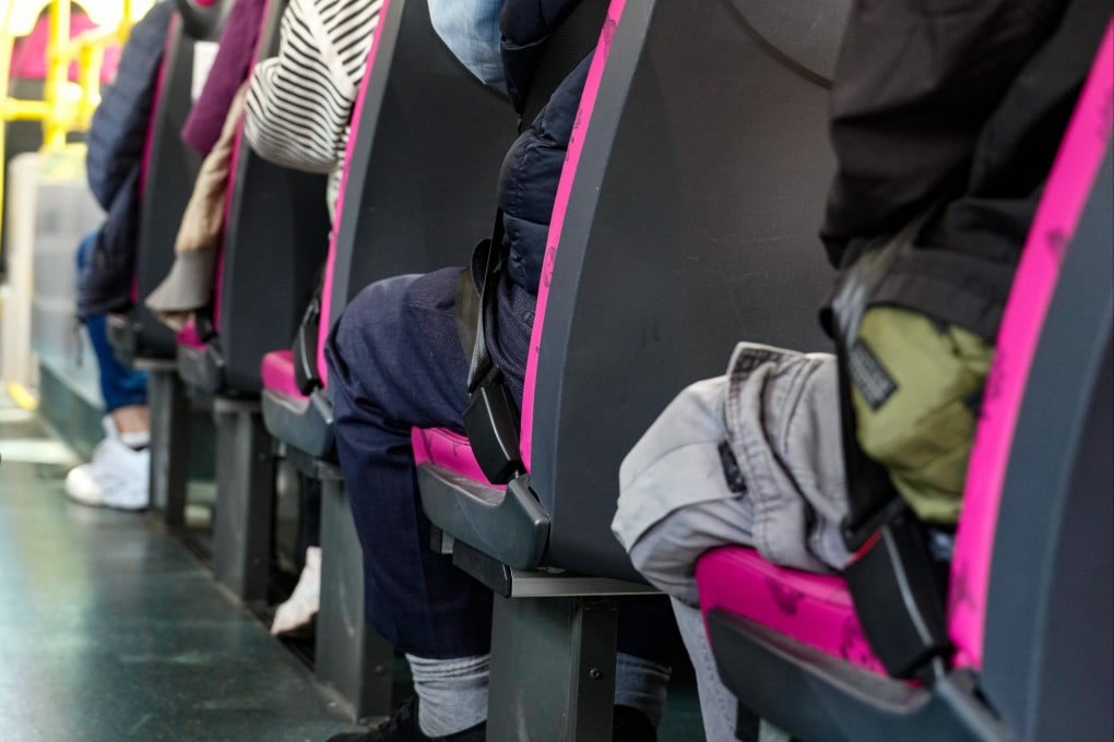 Passengers wear seat belts on a double-decker bus in Hong Kong’s Sham Shui Po on Thursday. Photo: Sam Tsang