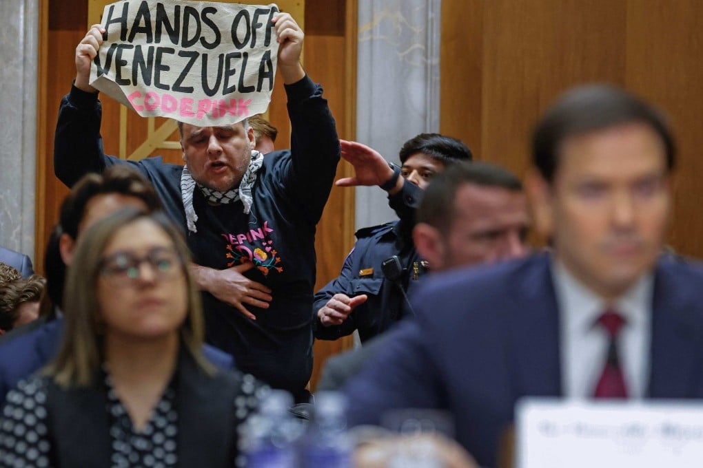 A protester interrupts US Secretary of State Marco Rubio (right) as he testifies before the Senate Foreign Relations Committee on Wednesday. Photo: Getty Images