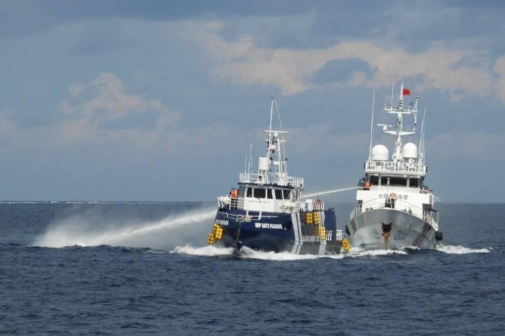 A China Coast Guard vessel (right) fires its water cannon at the Philippines’ BRP Datu Pagbuaya near Philippine-occupied Thitu island, locally called Pagasa island, in the disputed the South China Sea on October 12, 2025. Photo: Philippine Coast Guard via AP