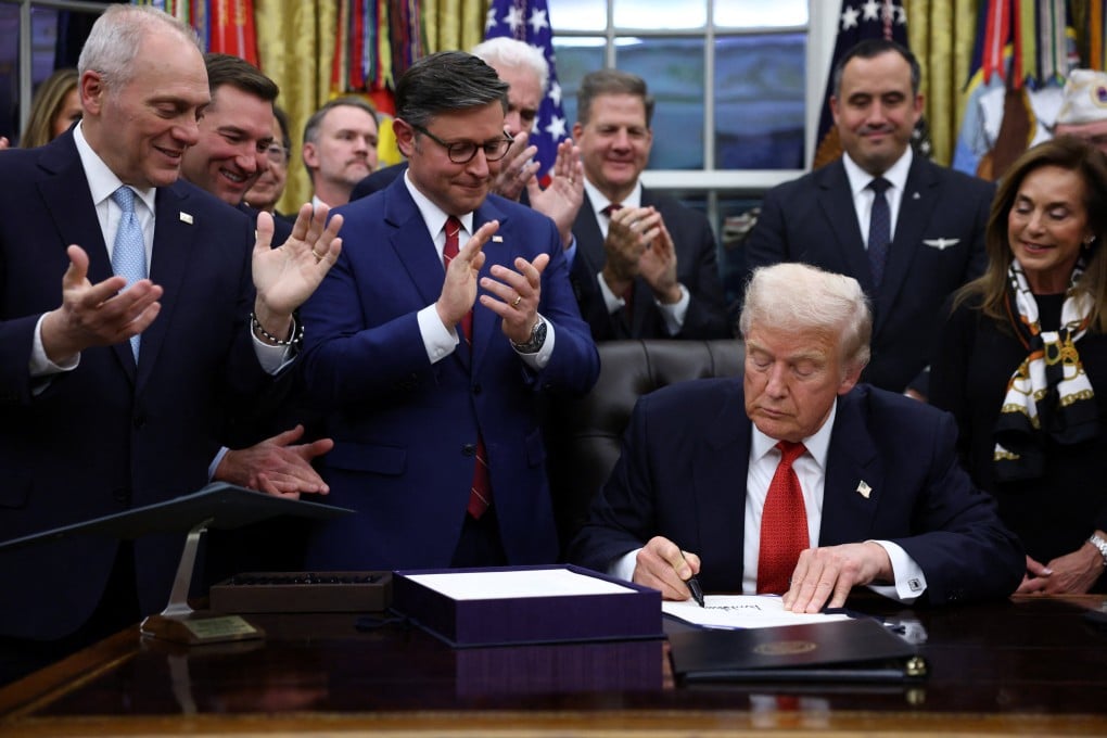 US President Donald Trump signs the funding bill to end the US government shutdown in November. Photo: Reuters