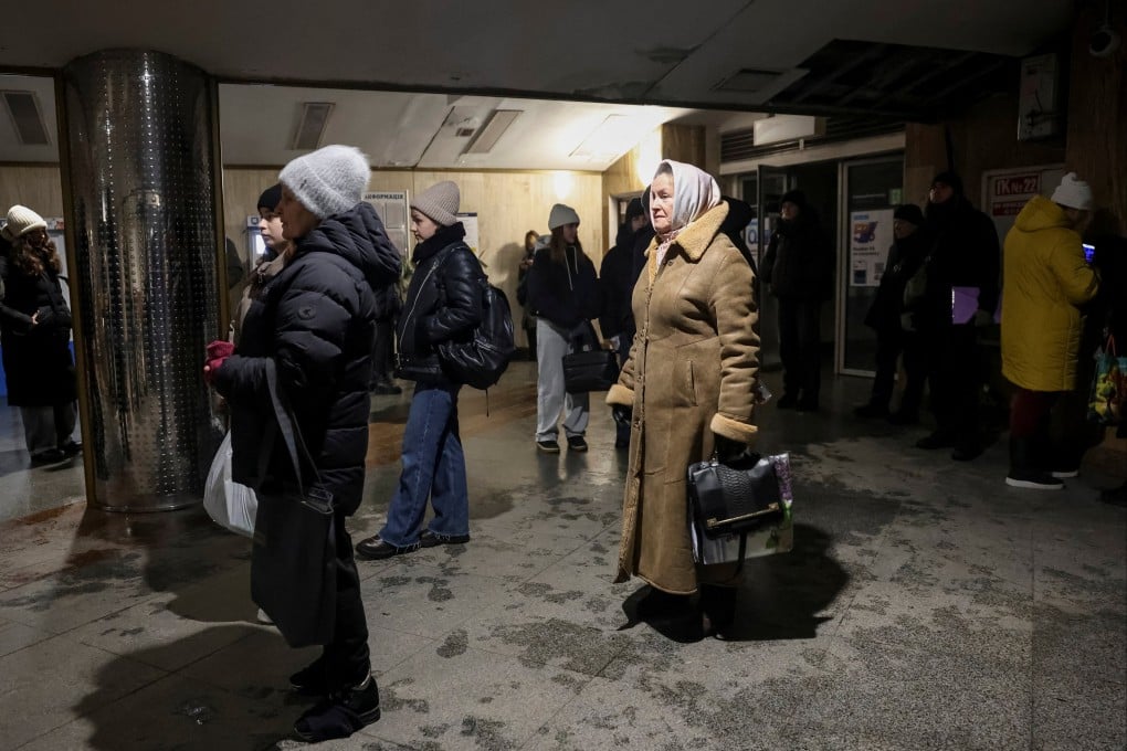 People in Kyiv stand at an entrance to a metro station while trains stopped running due to a blackout on Saturday. Photo: Reuters