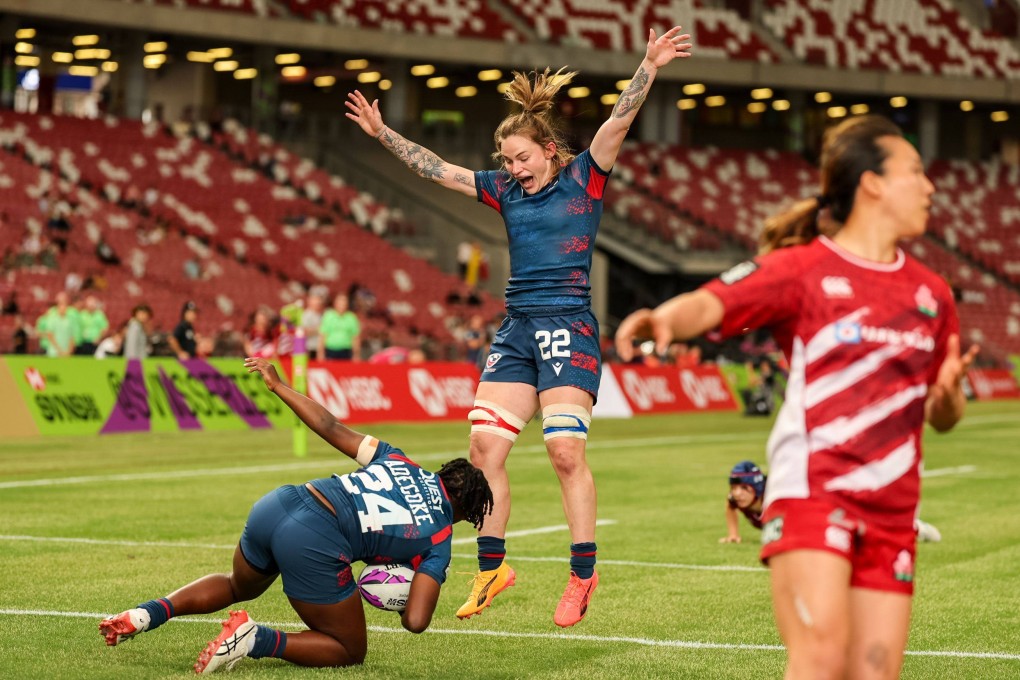 Team USA’s Sammy Sullivan (rmiddle) celebrates after Su Adegoke scores the winner in a 22-19 Pool A win over Japan on the first day of the HSBC SVNS Series in Singapore on Saturday. Photo: World Rugby