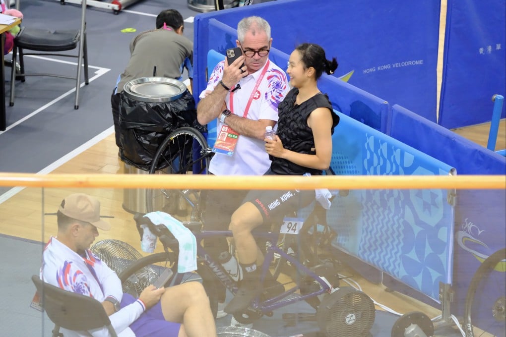 Herve Dagorne (left) talks to star rider Ceci Lee during training at the Hong Kong Velodrome. Photo: Karma Lo