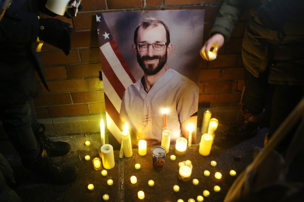 People light candles during a vigil for Alex Pretti in New York on Thursday. Photo: dpa