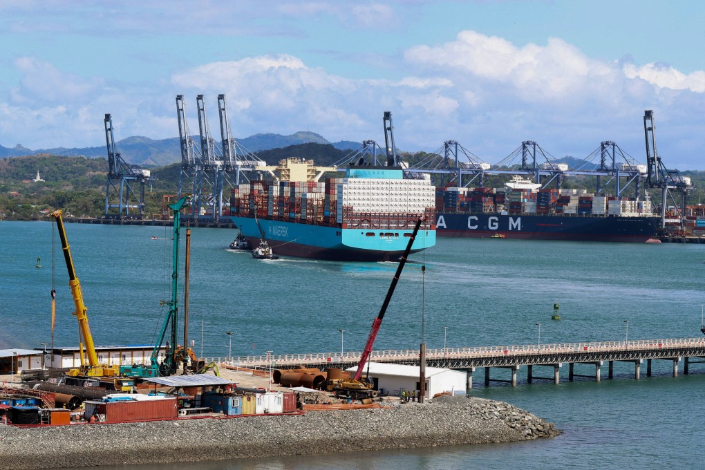 A container ship is guided by tugboats at a port in Panama. Photo: Reuters