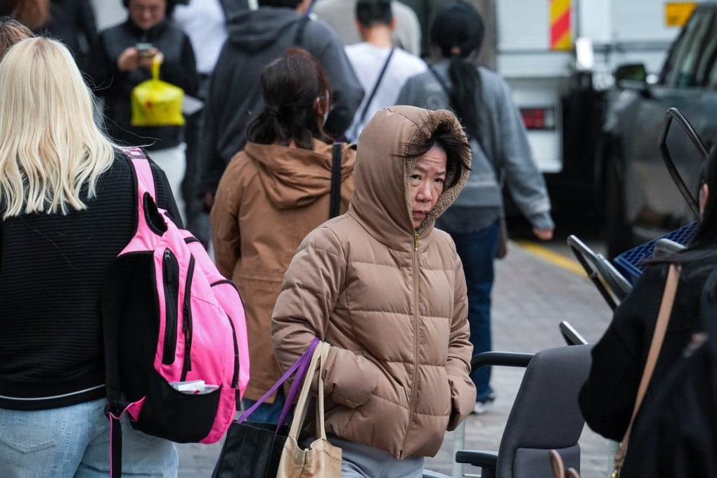 People in Central amid the cold winter weather. Photo: Eugene Lee