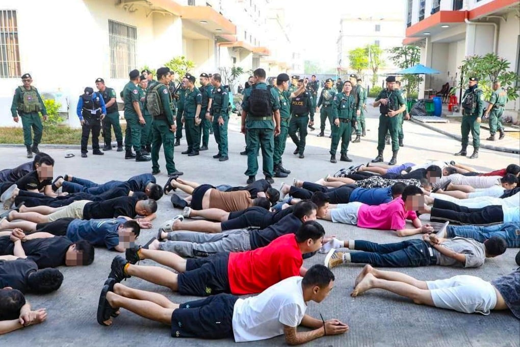 Apprehended suspects are lined up on the ground following a massive raid on a scam compound in Bavet city, southeastern Cambodia. Photo: Handout