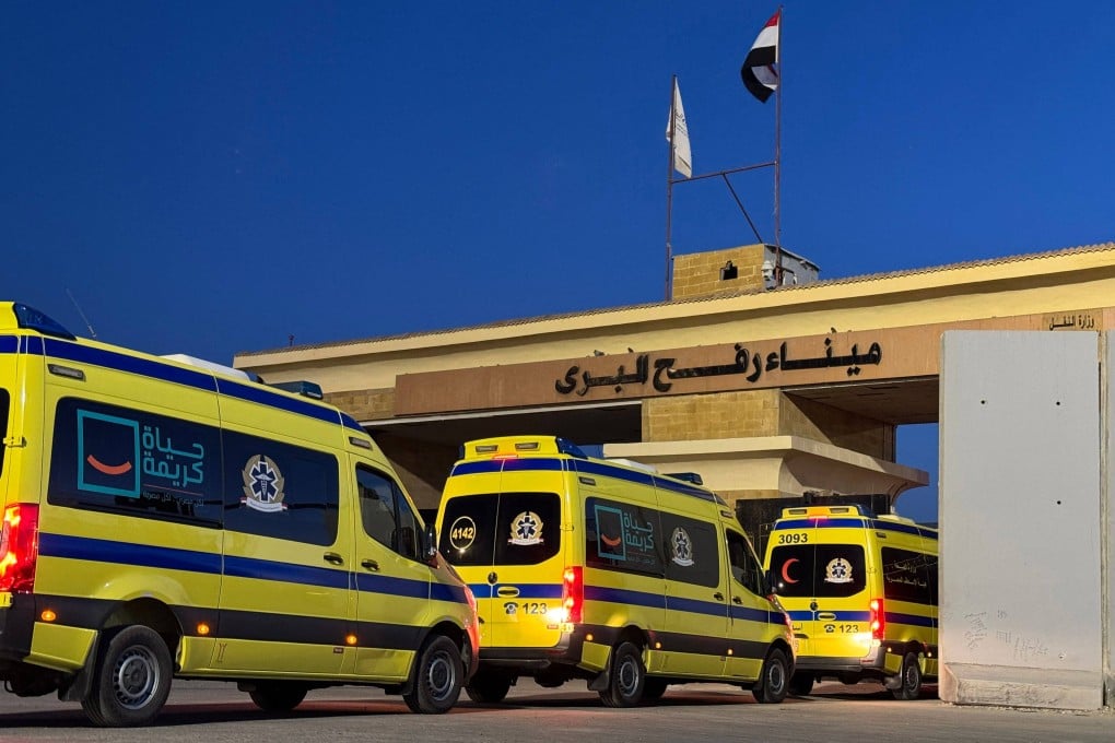 Ambulances wait in line at the Egyptian side of the Rafah border crossing with the Palestinian Gaza Strip on Monday. Photo: AFP
