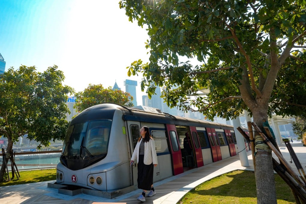 People visit “Harbour Station” at the Wan Chai harbourfront on January 13. Two retired train cars donated by the MTR Corporation are now displayed at the waterfront as a tourist attraction. Photo: Sun Yeung