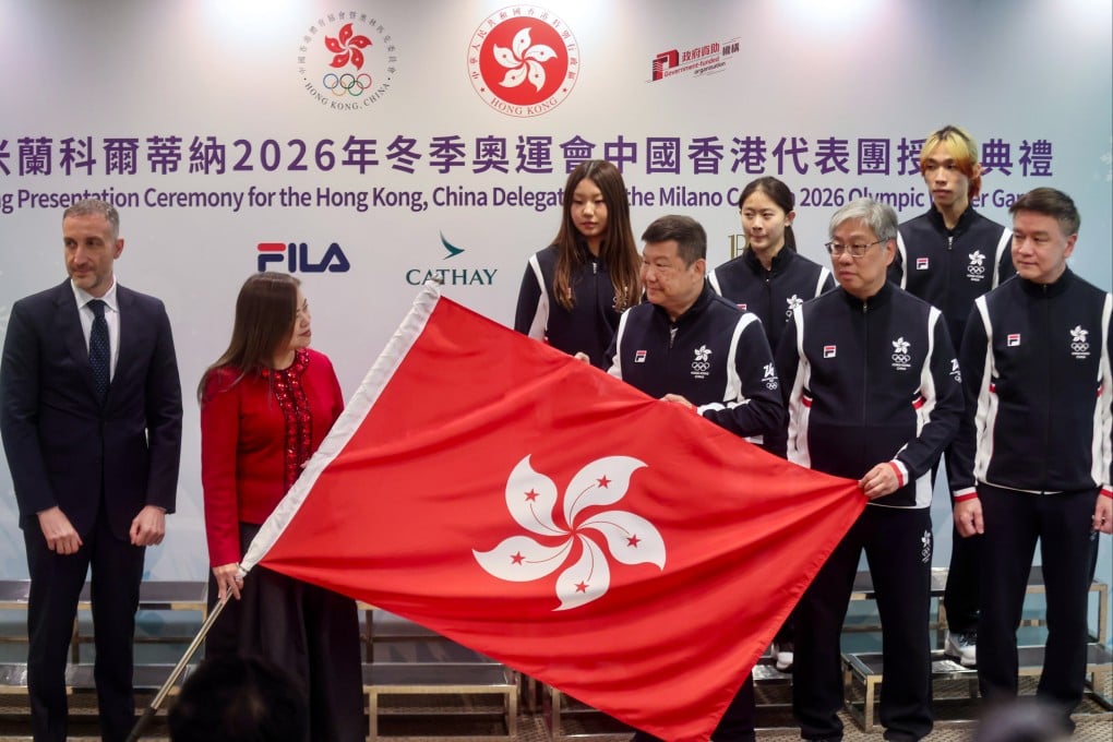 Sports minister Rosanna (left) Law presents the Hong Kong flag to members of the city’s Winter Olympics delegation. Photo: Jonathan Wong