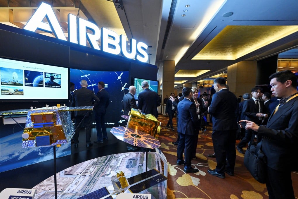 Visitors check out the Airbus booth at the Space Summit in Singapore on Monday. Photo: Reuters