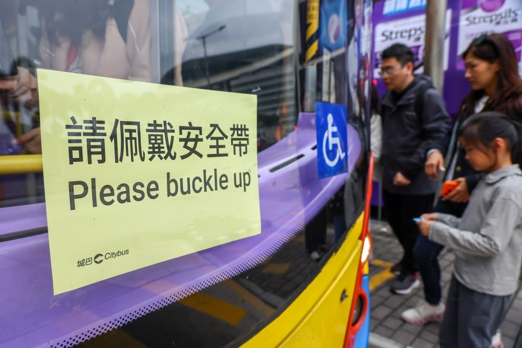A sign on a Hong Kong bus reminds passengers to buckle up. On January 30, the government said it would repeal the law on the seat belt requirement to address its deficiencies, five days after the law took effect. Photo: Dickson Lee