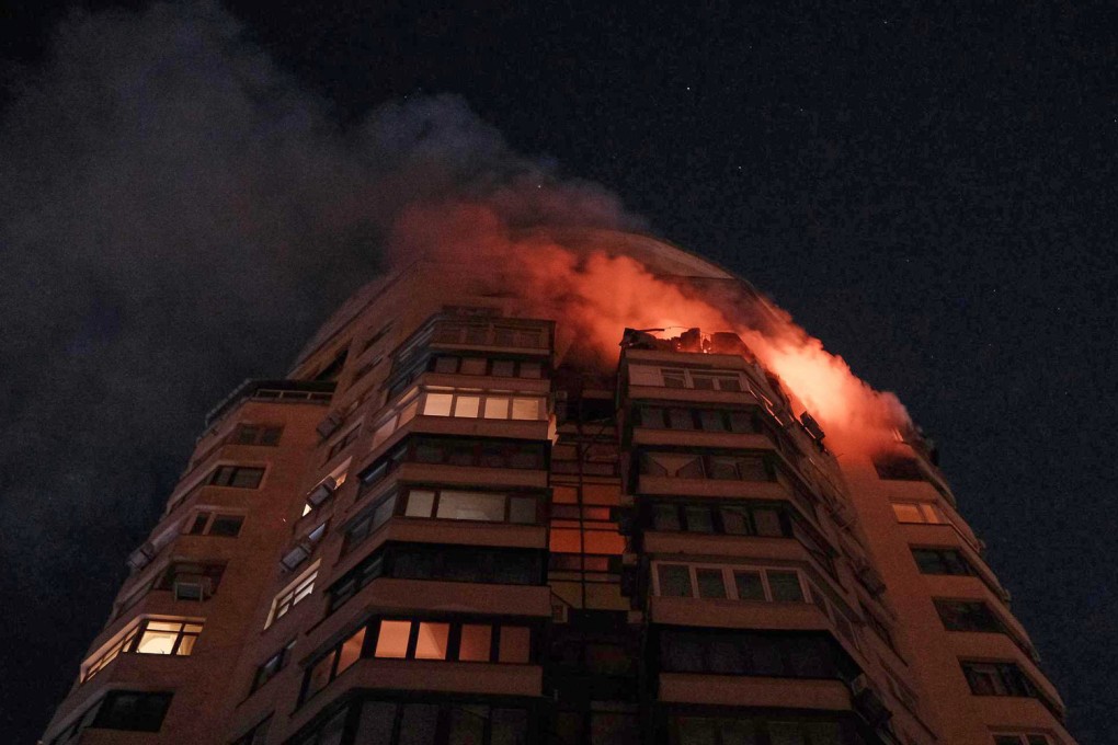 Emergency services personnel battle to extinguish a blaze at a multi-storey residential building after a Russian attack in Kyiv, Ukraine, on Tuesday. Photo: Ukrainian Emergency Service/AP