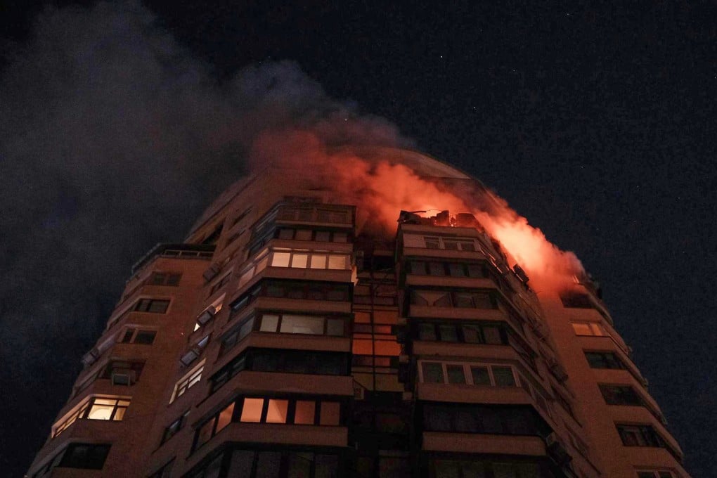 Emergency services personnel battle to extinguish a blaze at a multi-storey residential building after a Russian attack in Kyiv, Ukraine, on Tuesday. Photo: Ukrainian Emergency Service/AP