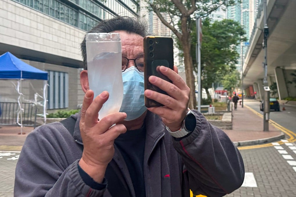 Taxi driver Lam Ching-fung leaves West Kowloon Court after being fined HK$1,000 for behaving in a rude manner towards a female passenger. Photo: Fiona Chow